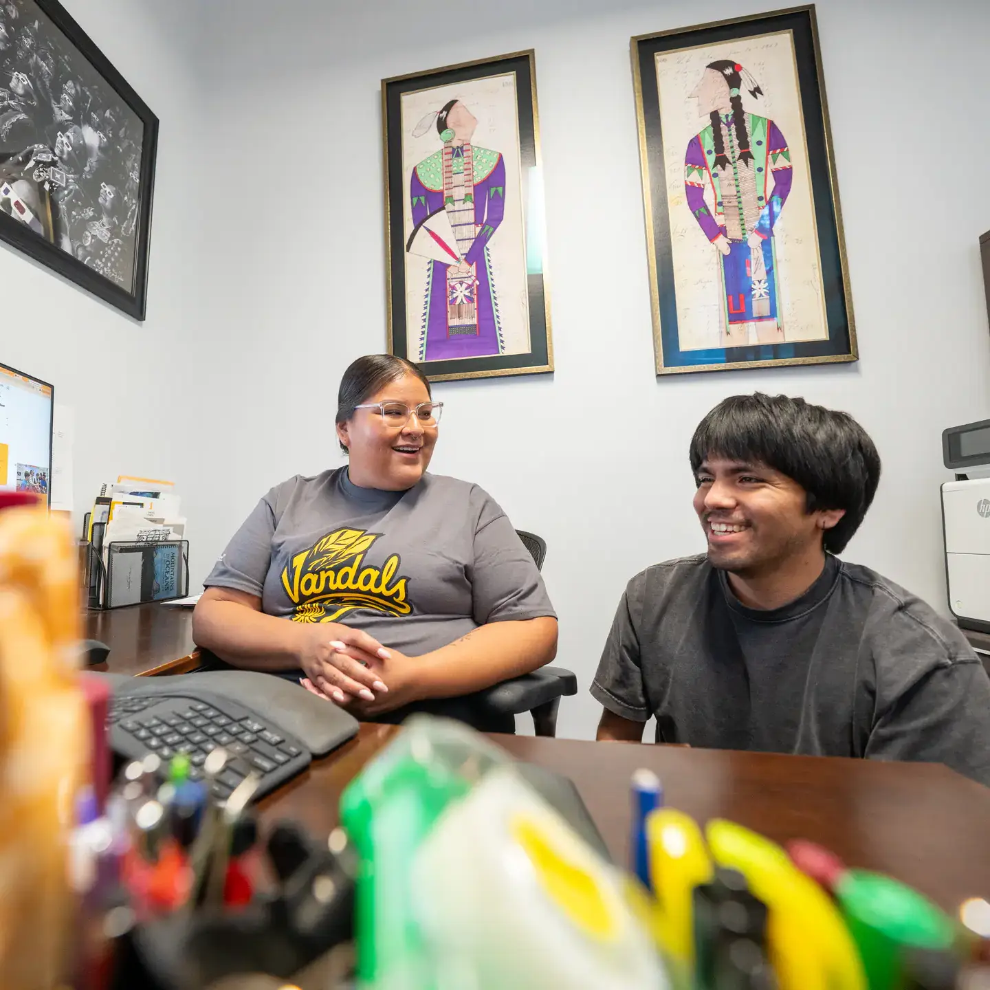 Jonas Oatman, a Nez Perce student who came to U of I through Tribal Nations Student Affairs’ Indigenous Nation Scholars Training for Excellence Program (INSTEP), is pictured at the Native American Student Center with Dakota Kidder, program coordinator for Tribal Nations Student Affairs, on Thursday, June 25, 2026. After graduating in Spring ’26 with a BS in Computer Science and a BS in Mathematics, Oatman will be continuing at the U of I for a master's in computer science.