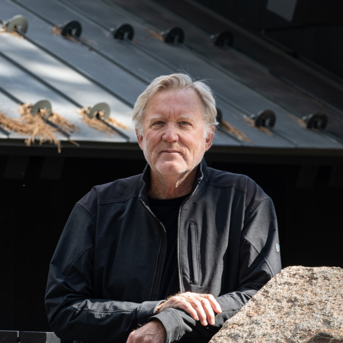 Mark de Reus poses outdoors for a portrait.