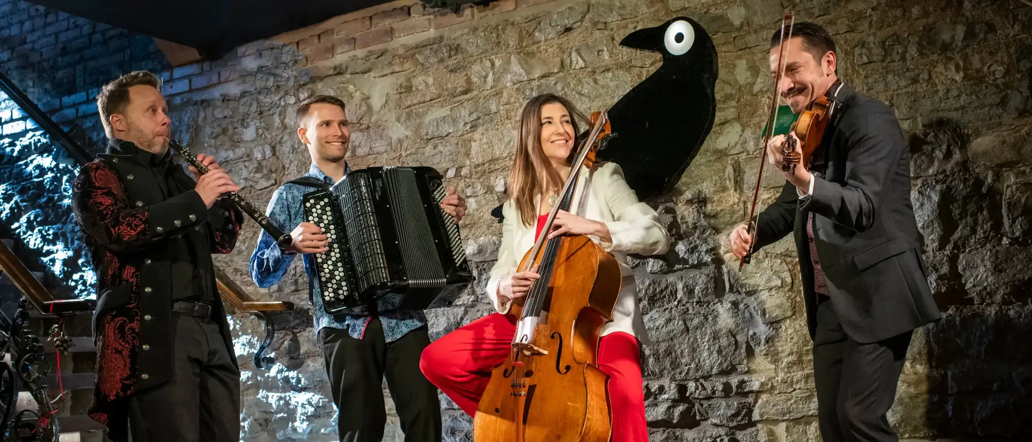 A band playing their instruments on stage.