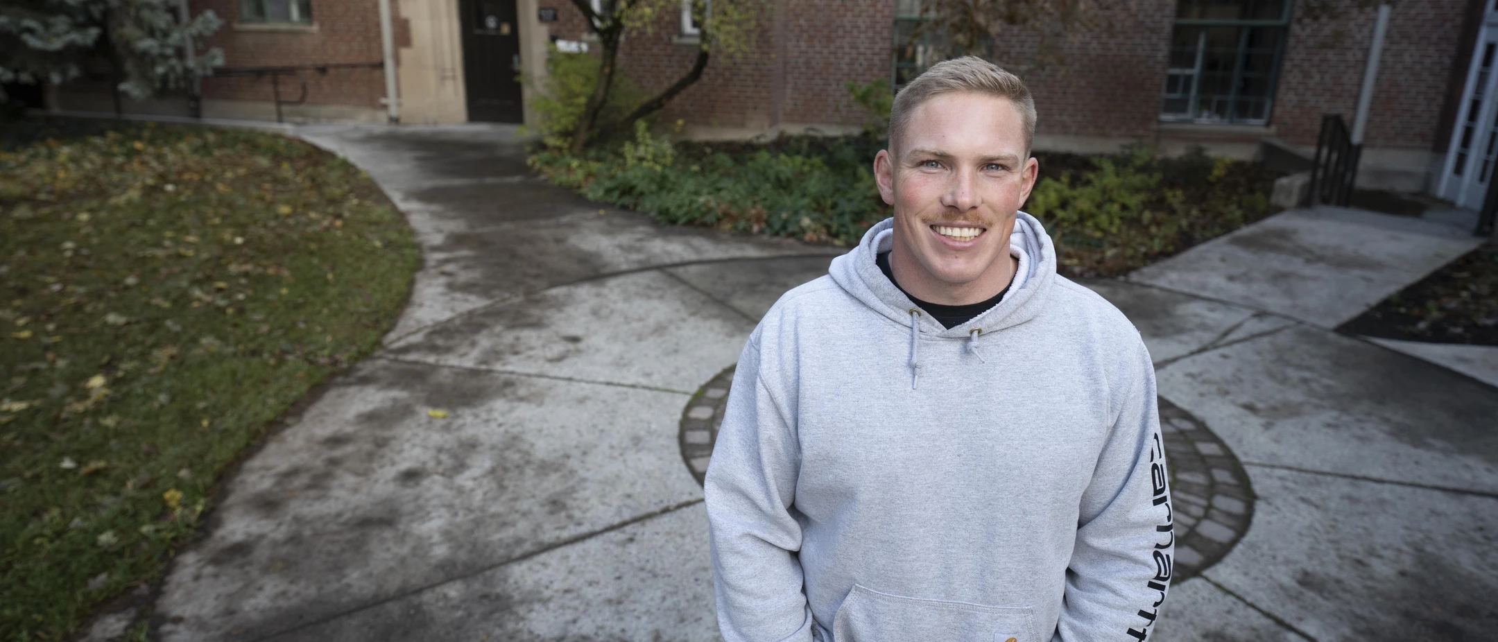 Zach Jensen standing in front of a building