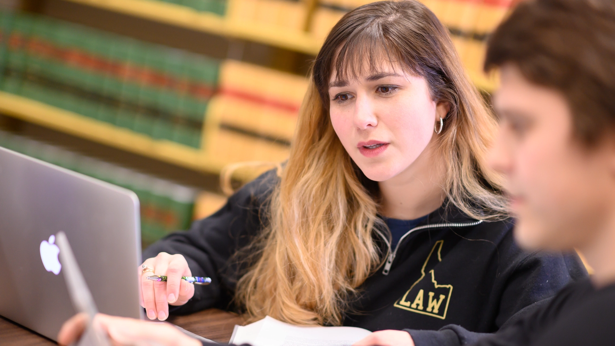 Two students work in the Law Library.