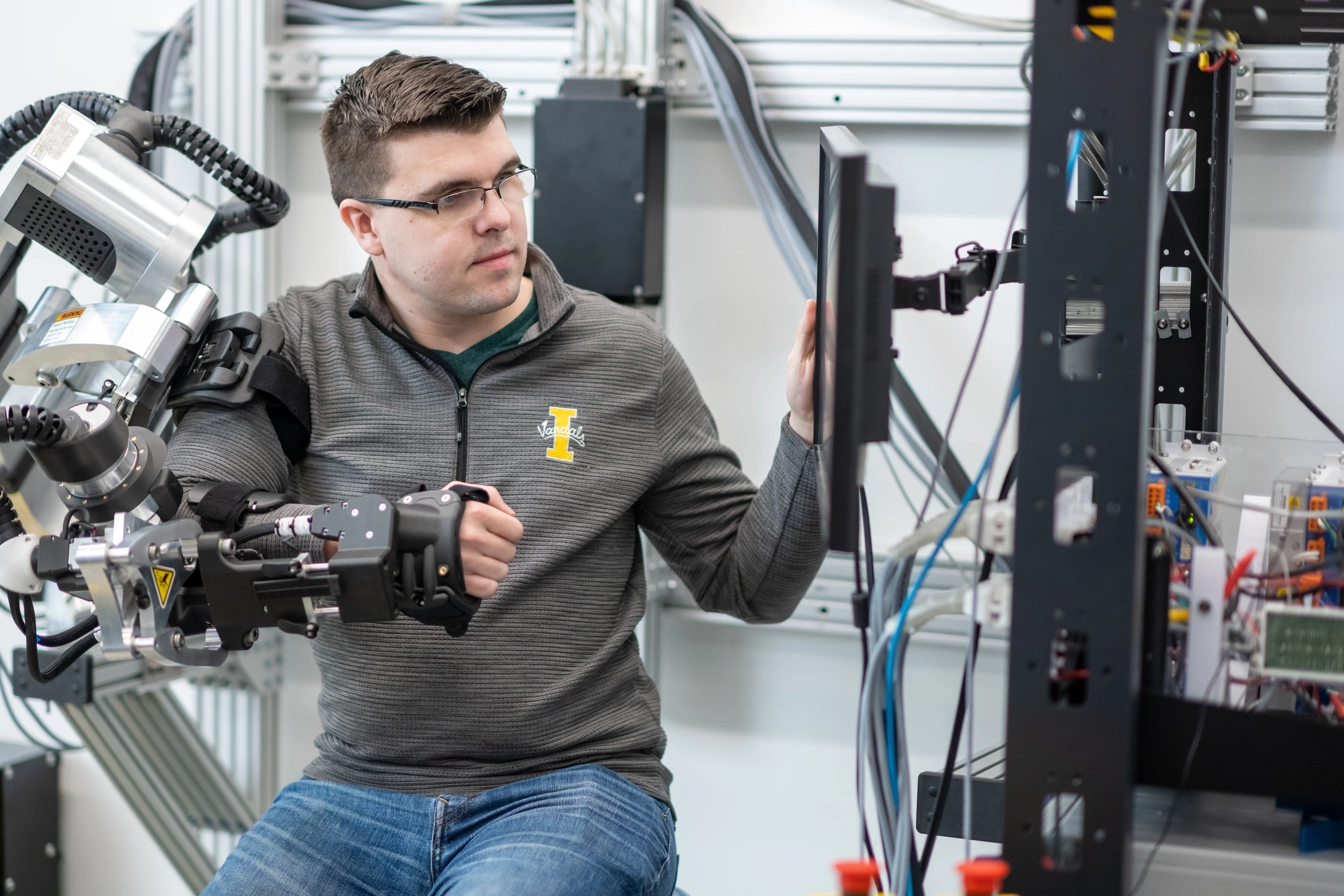 University of Idaho College of Engineering students and faculty working with therapeutic robots made to assist in physical therapy.