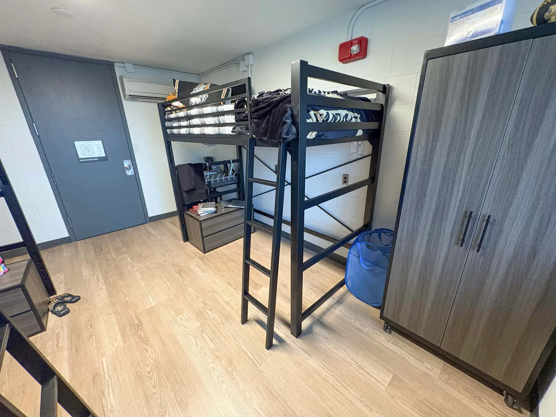 The renovated tower room, showing a loft bed with room under it for a desk, and a sizeable closet.