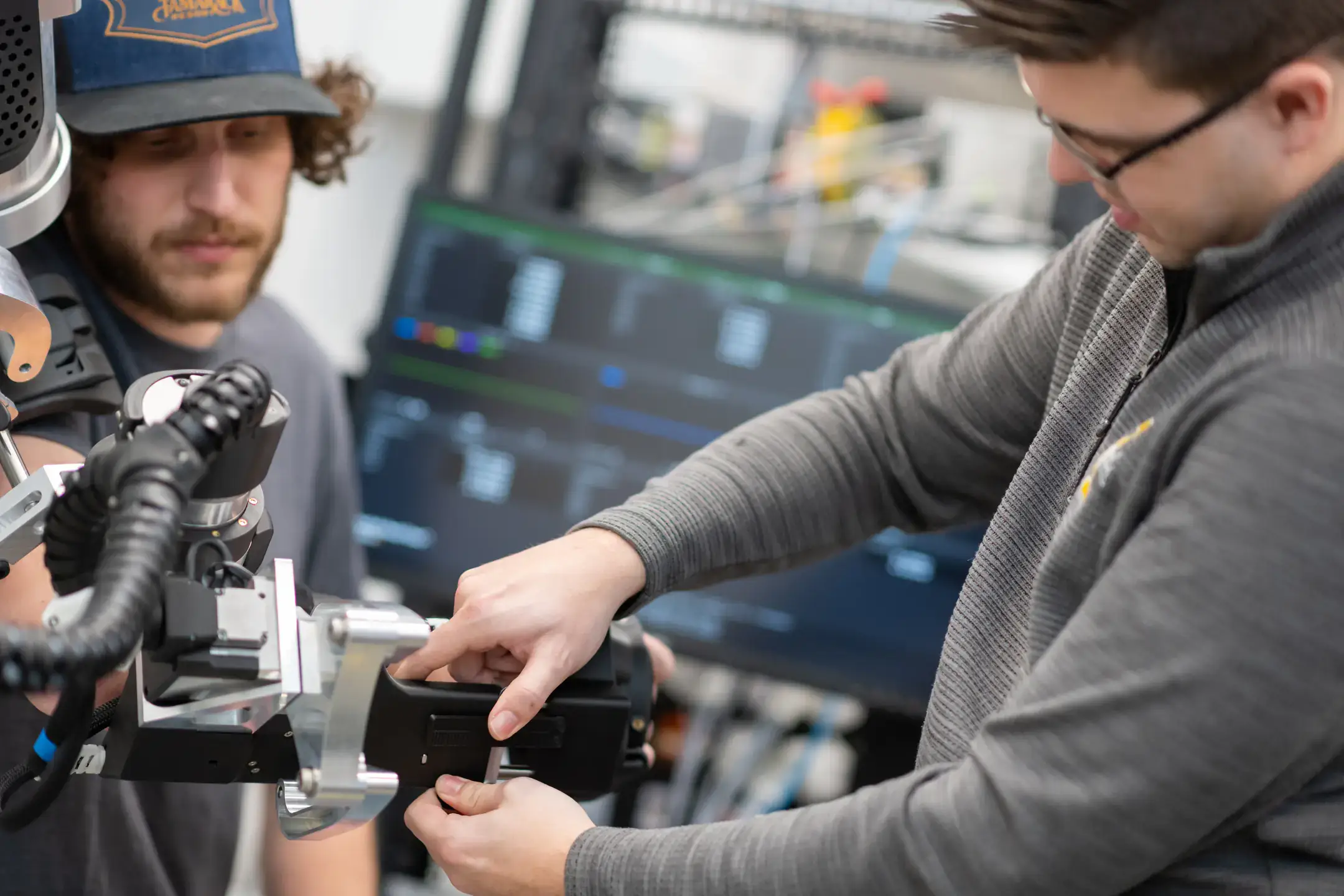 University of Idaho College of Engineering students and faculty working with therapeutic robots made to assist in physical therapy.