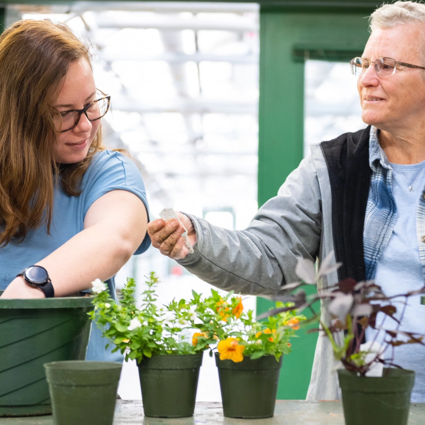 University of Idaho Parent & Family Weekend; families check out the Sixth Street Greenhouse for "Parents & Plants".