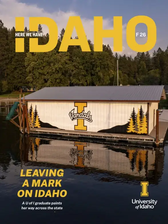 Idaho magazine banner showing a painted University of Idaho boathouse on a lake, with headline 'Leaving a Mark on Idaho'.