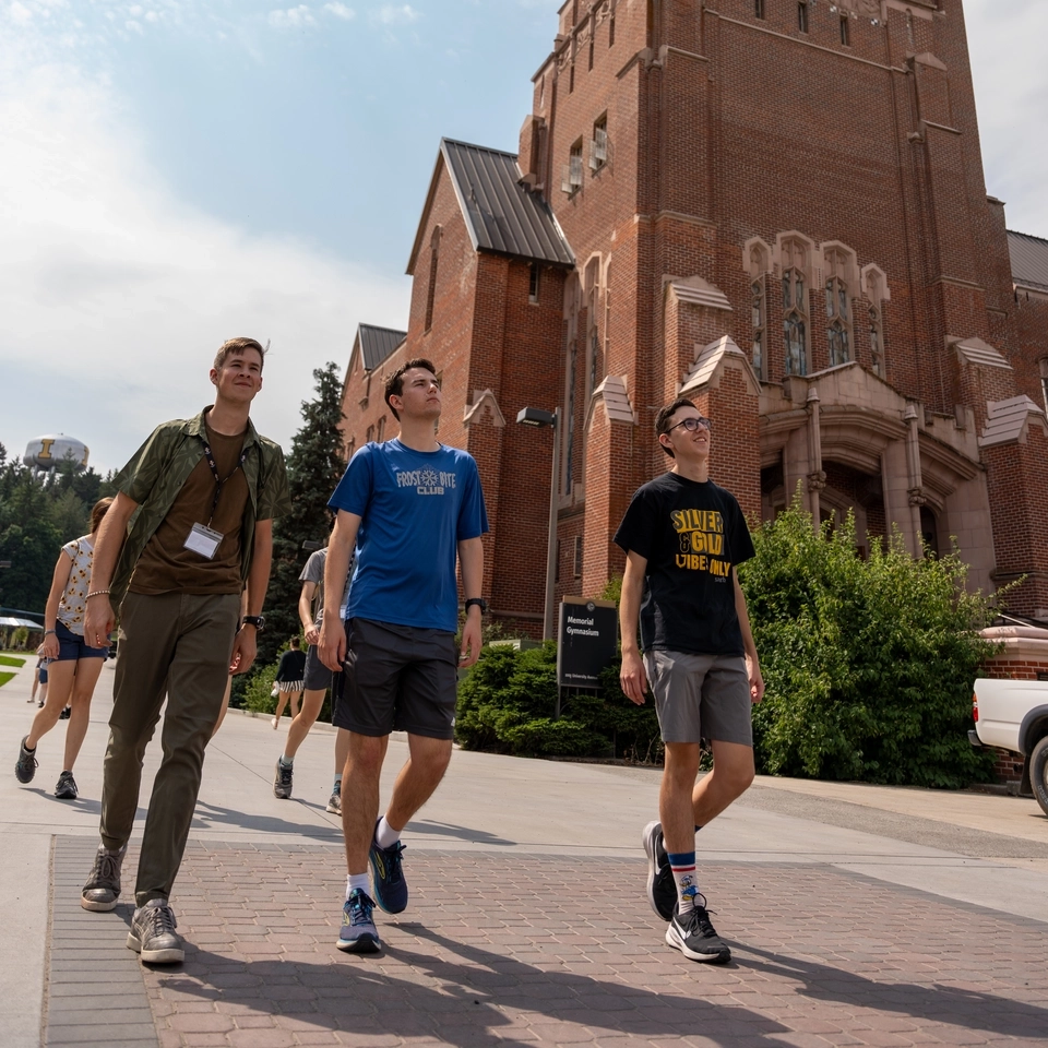 Students walk past Memorial Gym