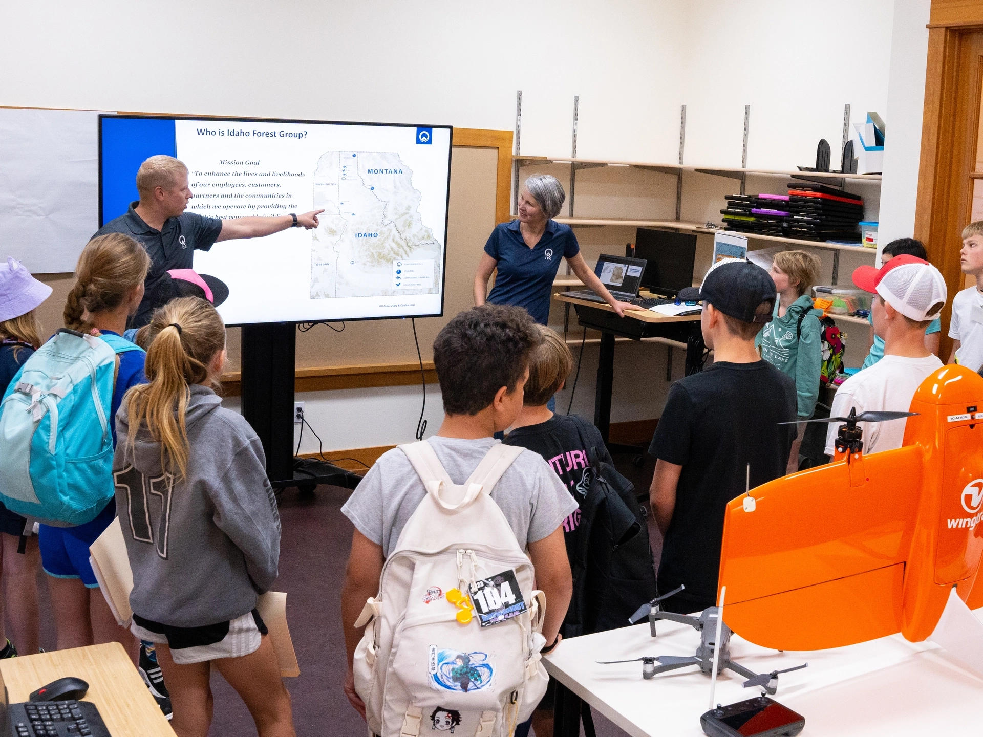 Young students watching a presentation in class