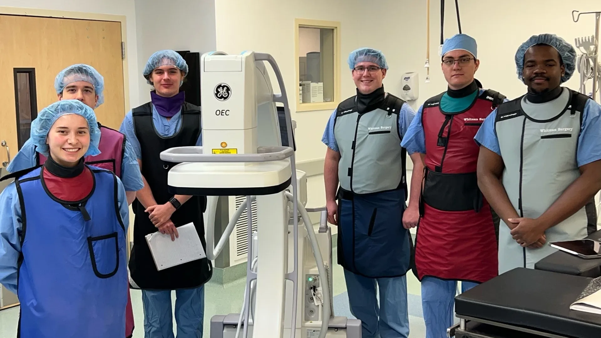 The team poses with a C-arm at Whitman Hospital and Medical Clinics