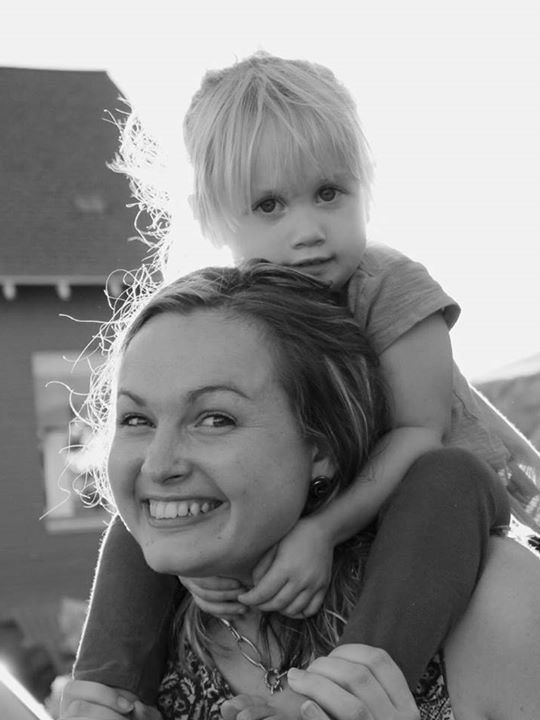 Girl on woman’s shoulders