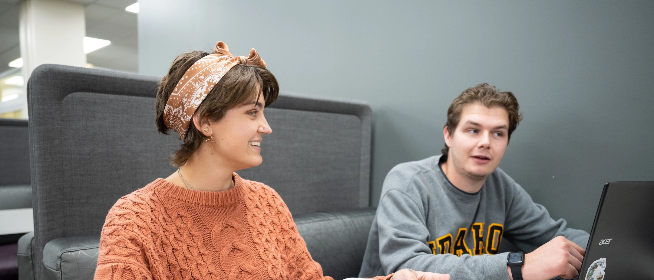 Student Jordan Wagner with another student in the University of Idaho 1st floor study area.