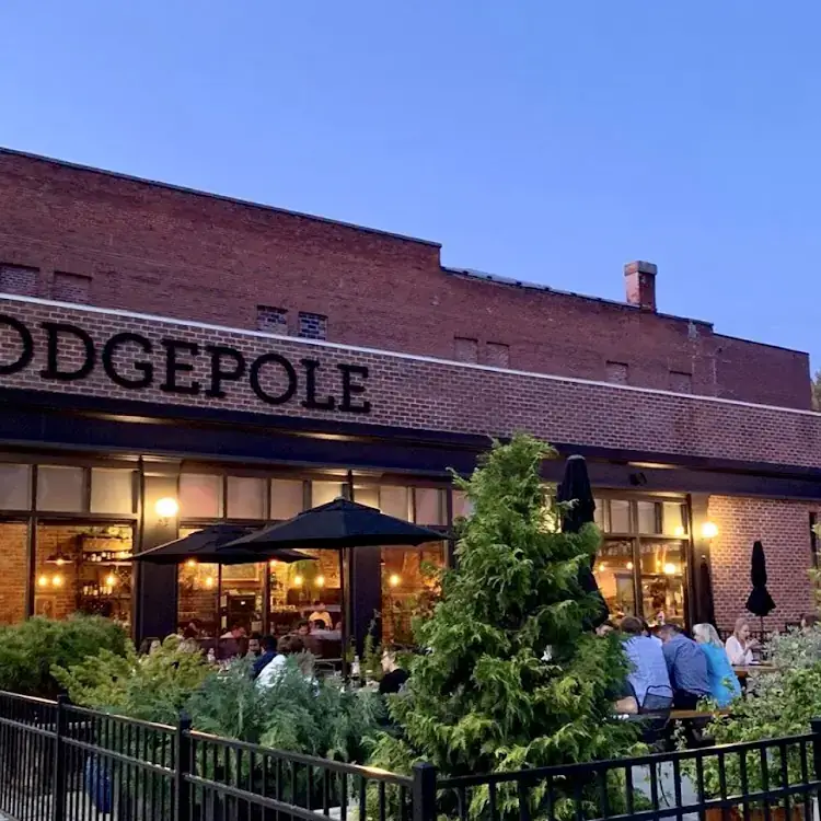 Customers having outdoor seating at a restaurant.