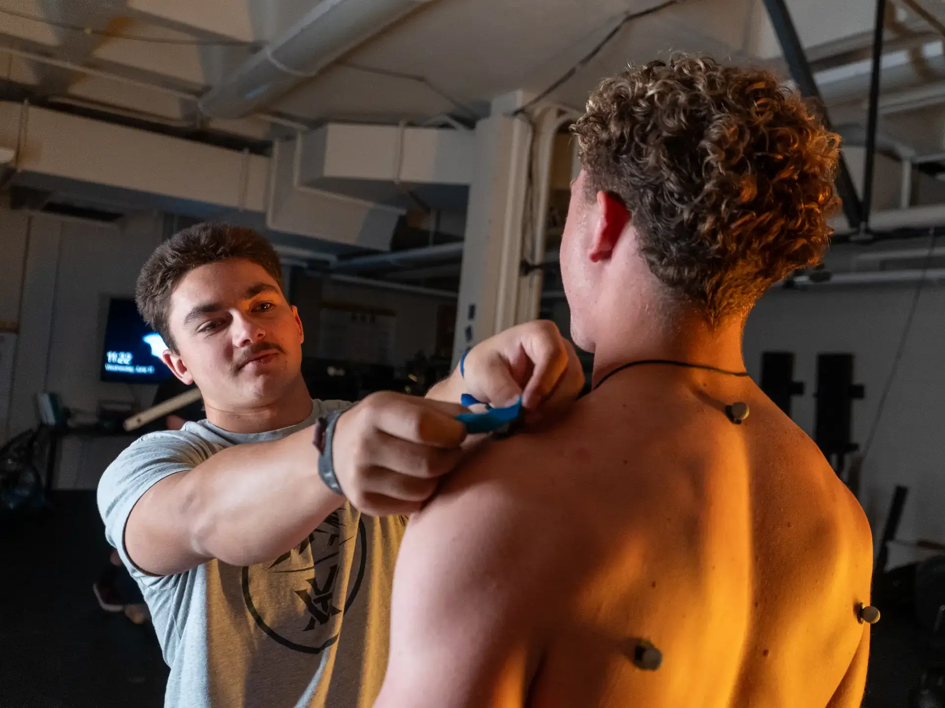 Jared Hanchey does movement science research with Joshua Bailey on Wednesday, June 11, 2025 at the Integrated Sports Medicine Movement Analysis Laboratory in the Physical Education Building. Hanchey is studying the effects of isometric and generalized warmups for deadlift performance.