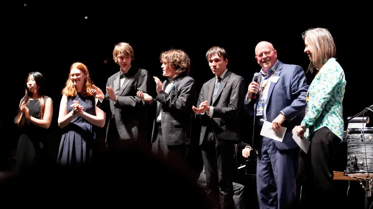 Vanessa Sielert and Paul Kimmel give the Avista Scholarships to winners at the 2023 University of Idaho Lionel Hampton Jazz Festival.