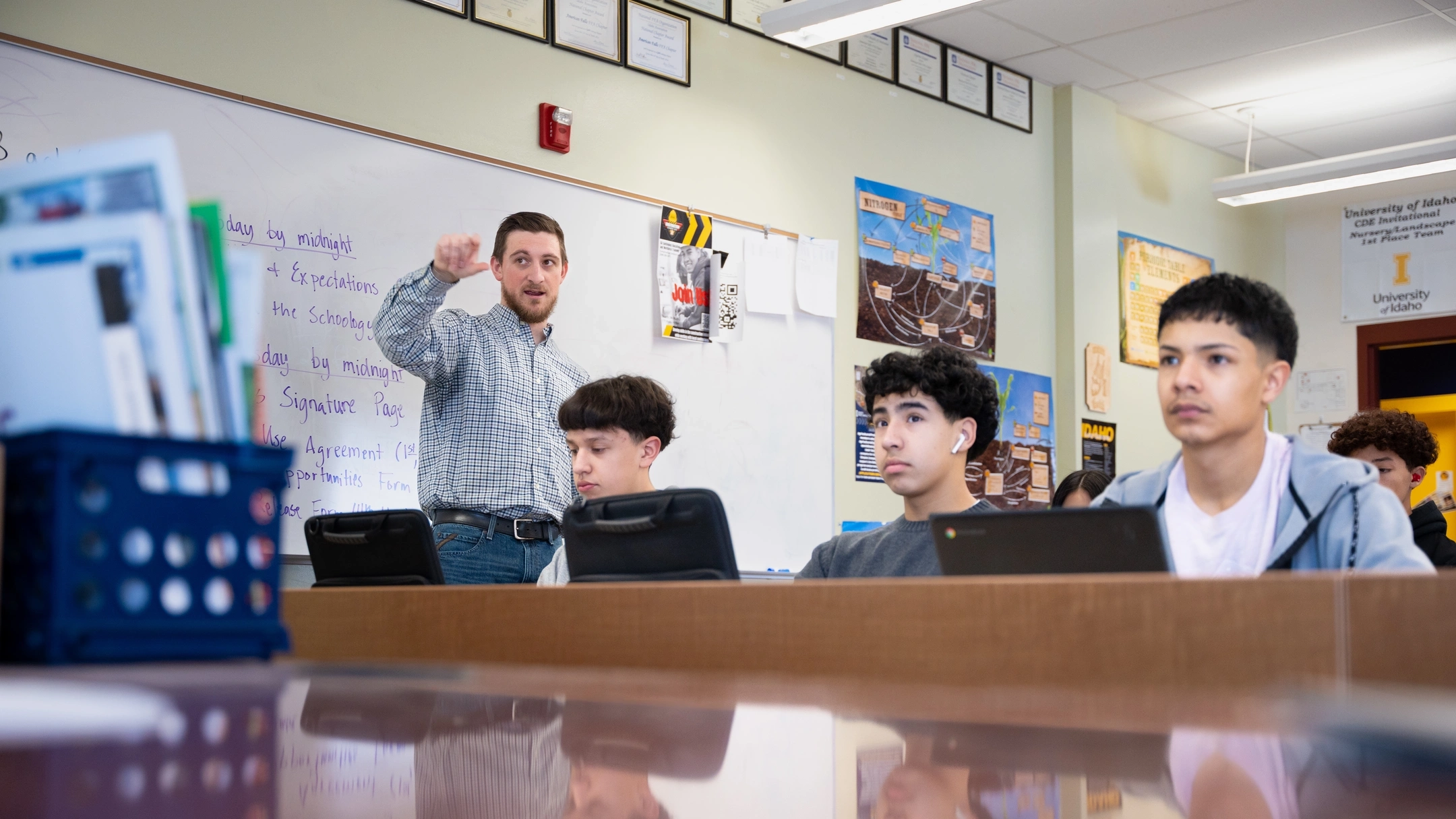A man and students in a classroom
