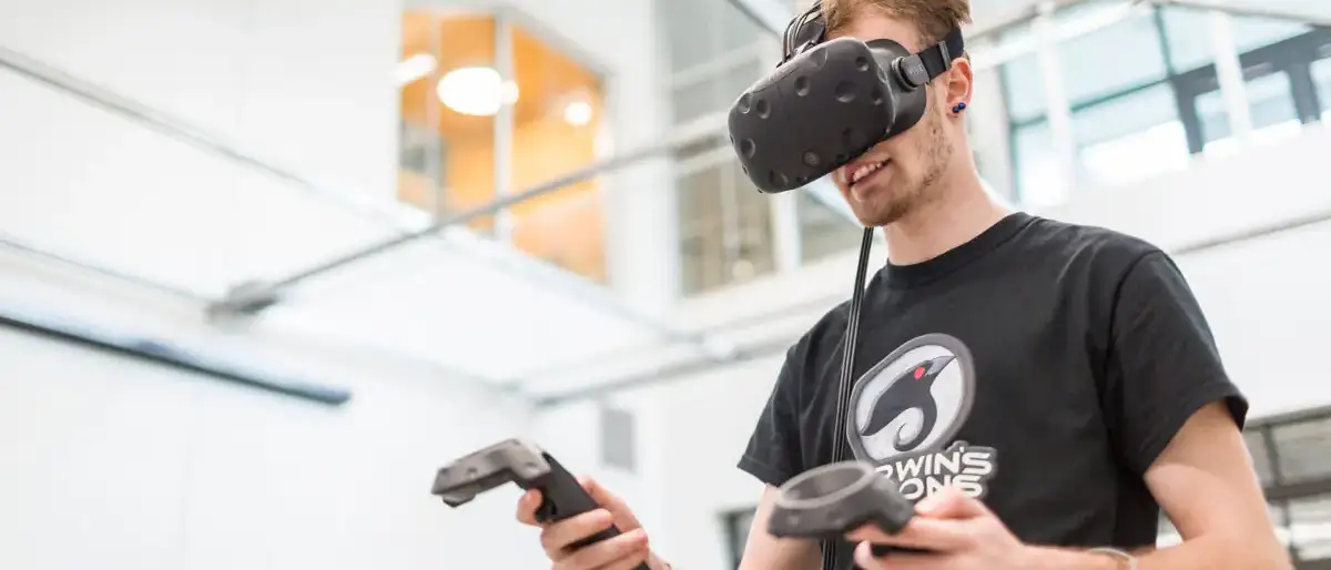 Virtual Technology and Design student with virtual technology device on their body