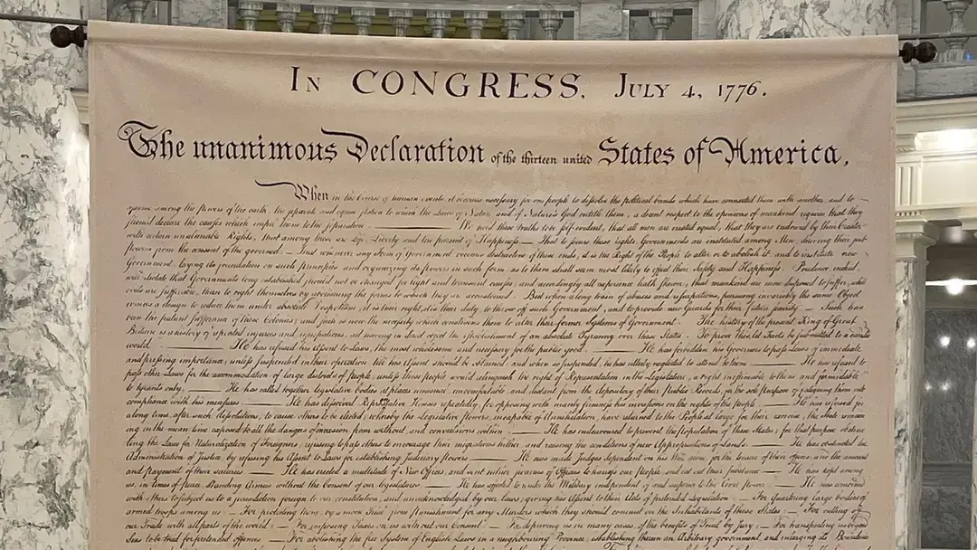 A fabric printing of the United States Constitution hangs in the Boise Capital.