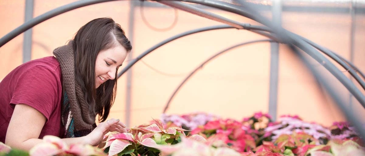A student in the greenhouse