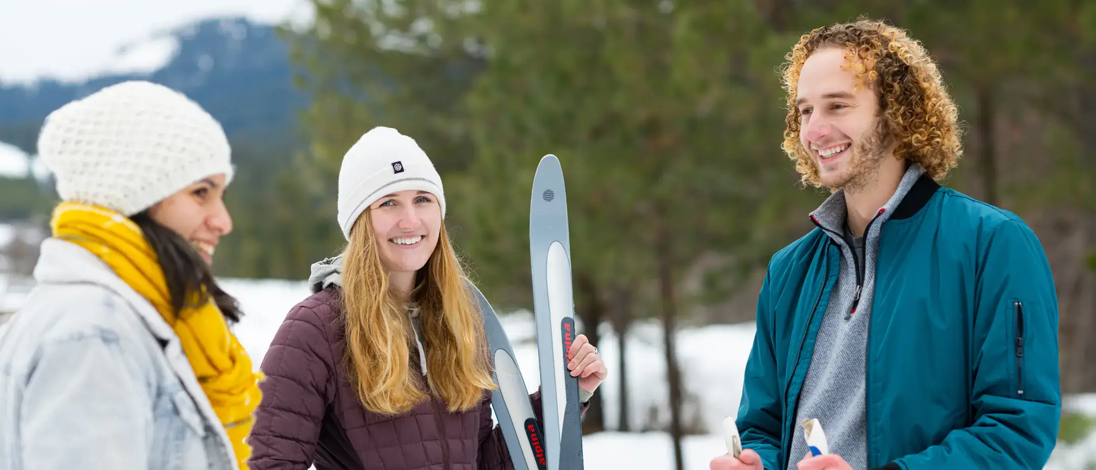 University of Idaho students enjoying the outdoors in the winter while being cozy with one another. Embracing the Norwegian idea of "koselig".