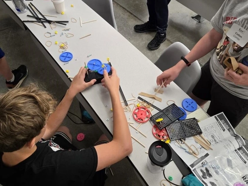 Children constructing mini cars