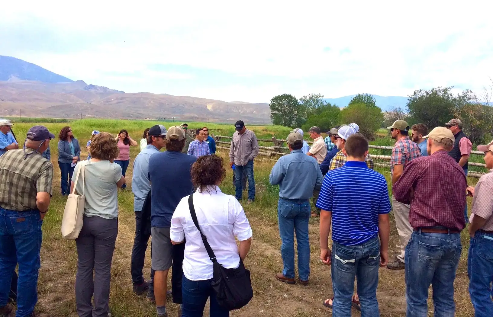McClure salmon research working group gathered in field near the river.
