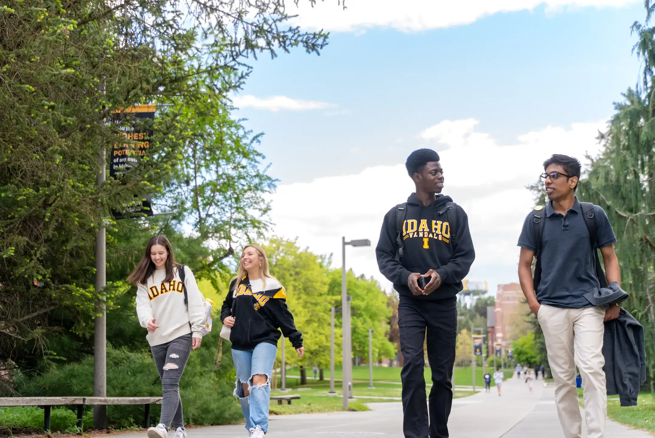 Students walk together down the Academic Mall on Monday, May 5, 2025.