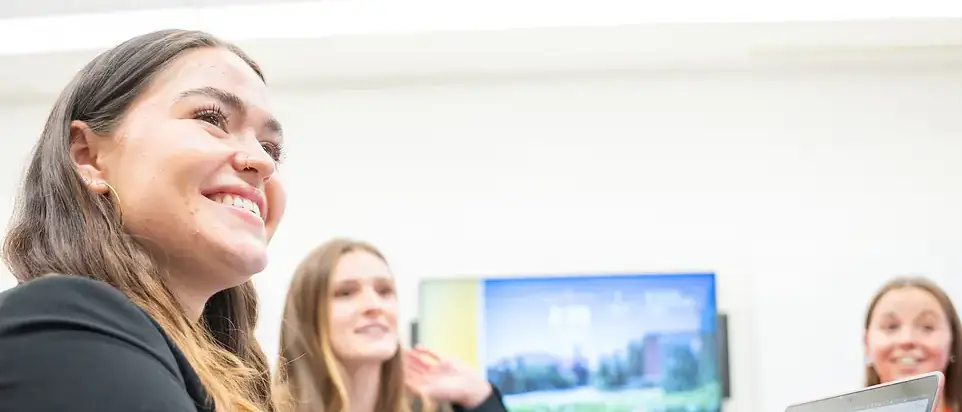 Students in the Administration building working on a Moscow School District ad campaign presentation for their Public Relations course.