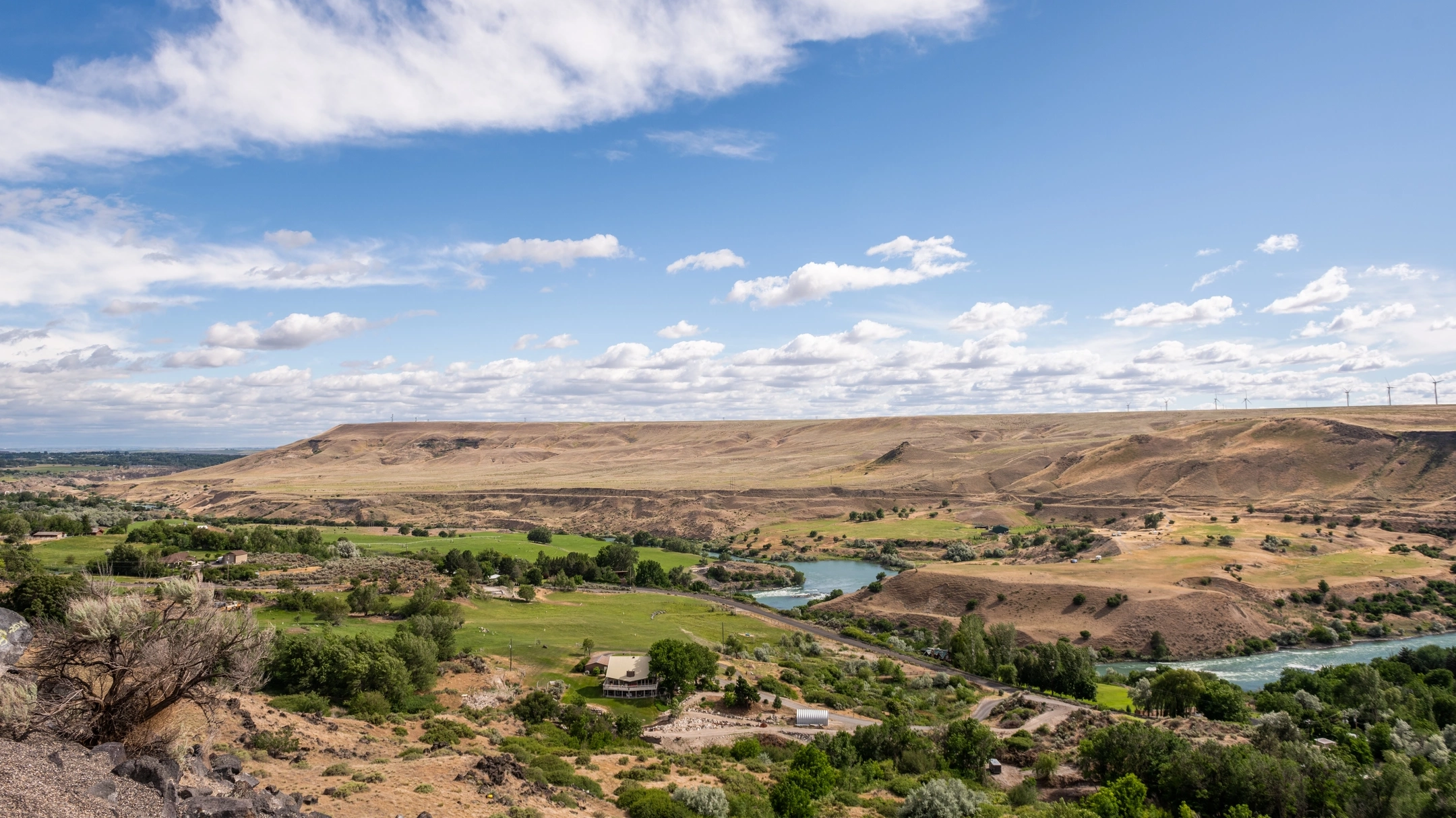 Snake River with mountains and farmland around it.