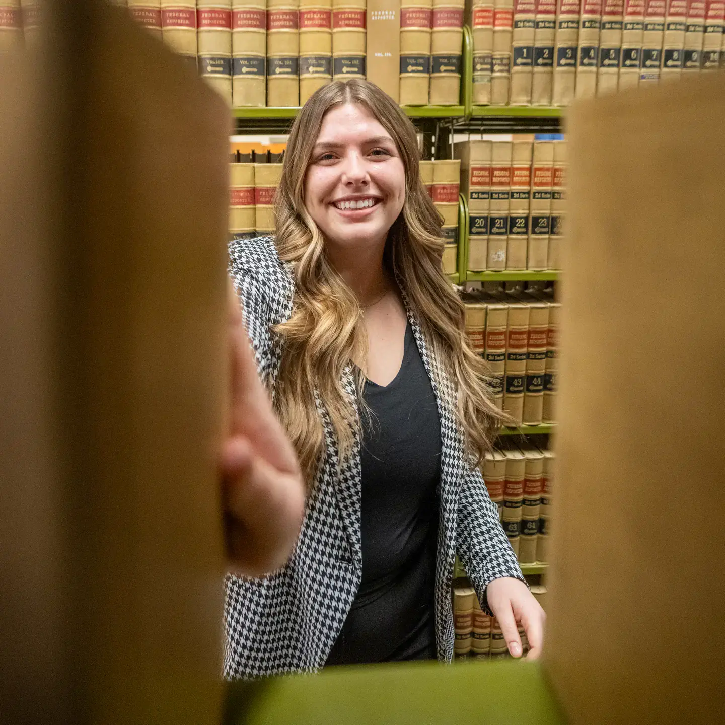 Law student Isabella Sindelar is photographed at the Menard Law Building on the Moscow campus grabbing a book.