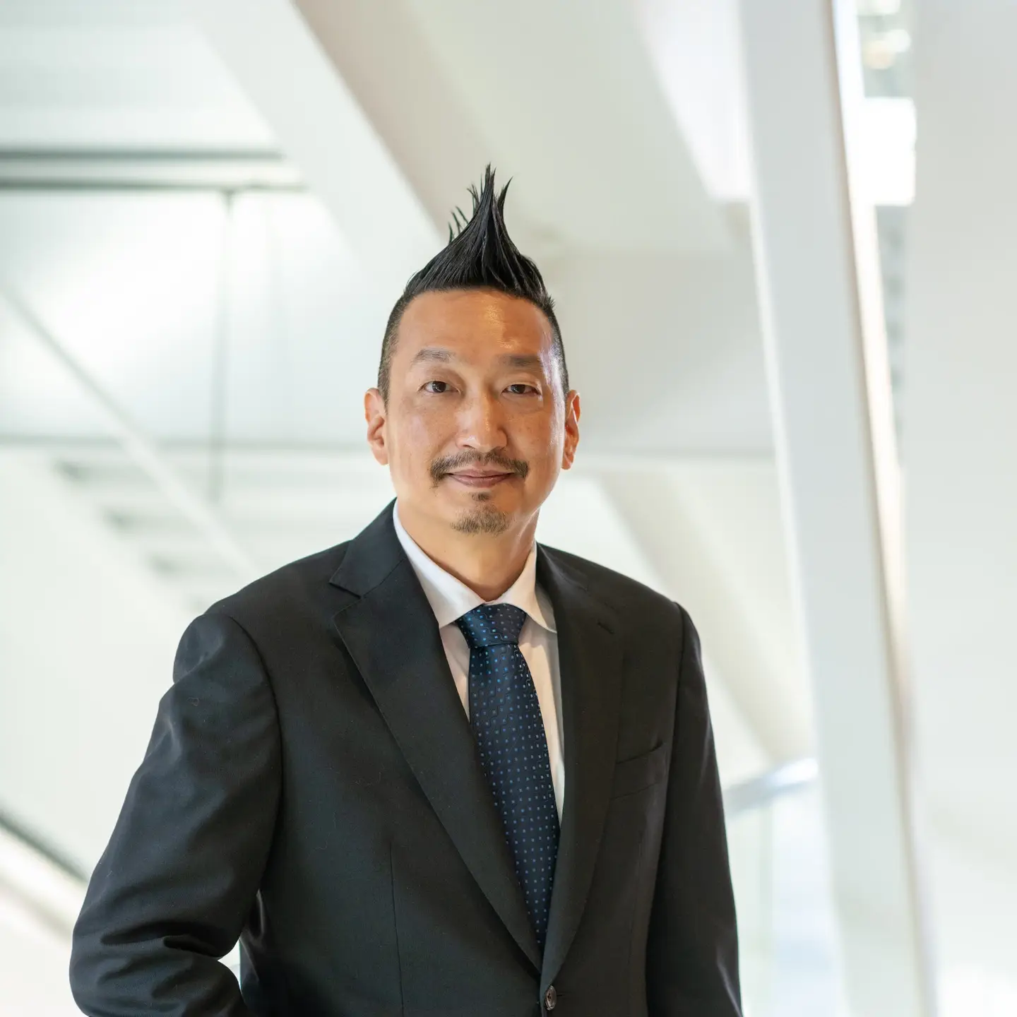Portraits of Research and Economic Development VP, Chris Nomura.