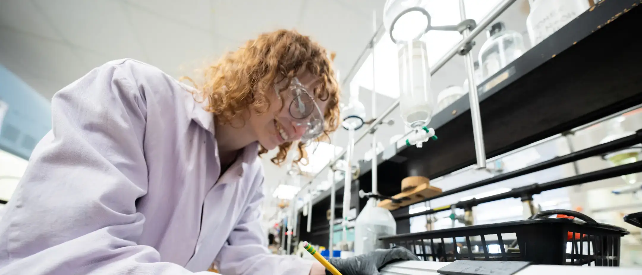 Maddie Moody works in a fume hood separating elements in Dr. Wandruszka's Lab in Renfrew Hall on the University of Idaho campus.