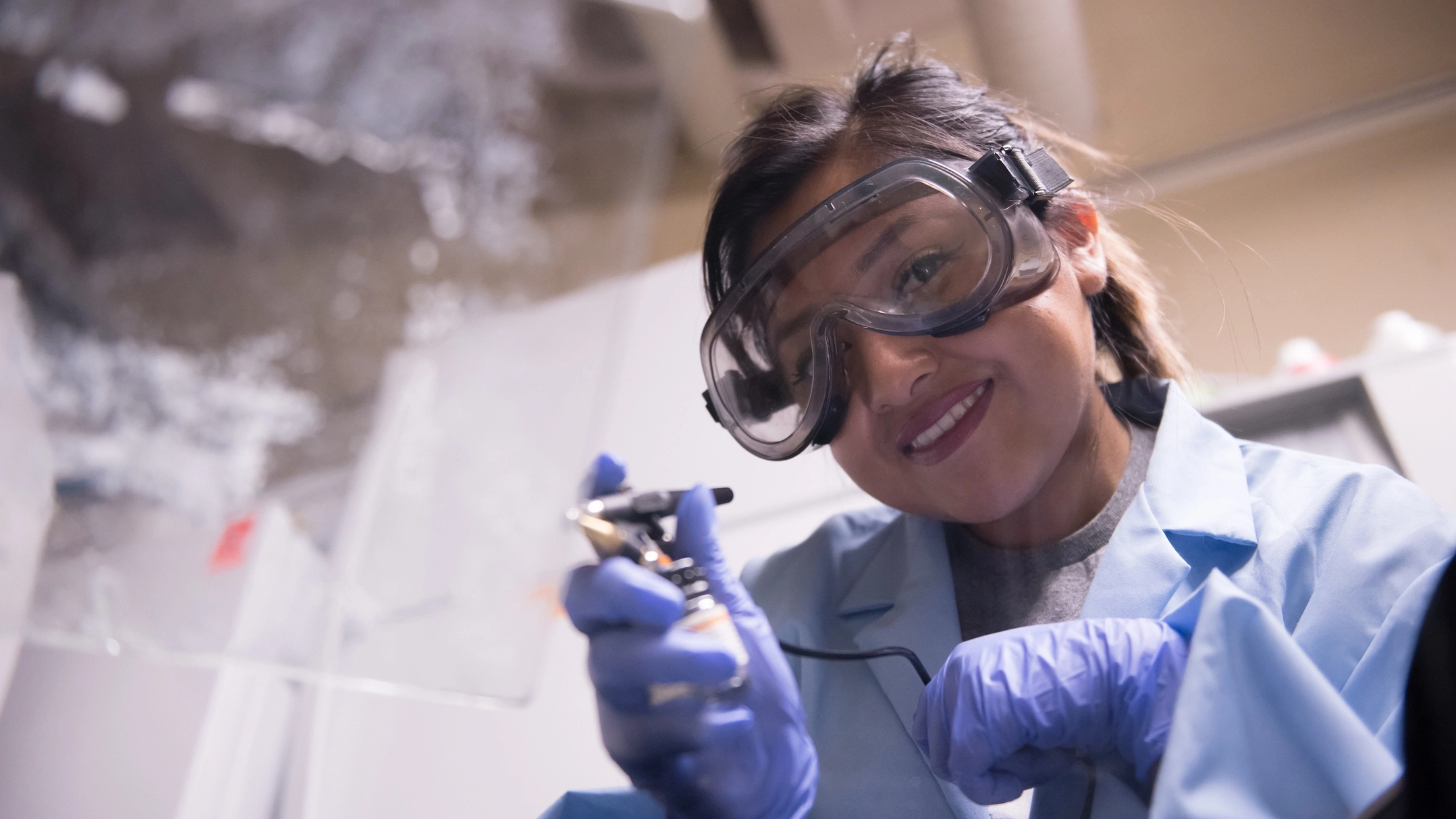 Woman holding up test tube