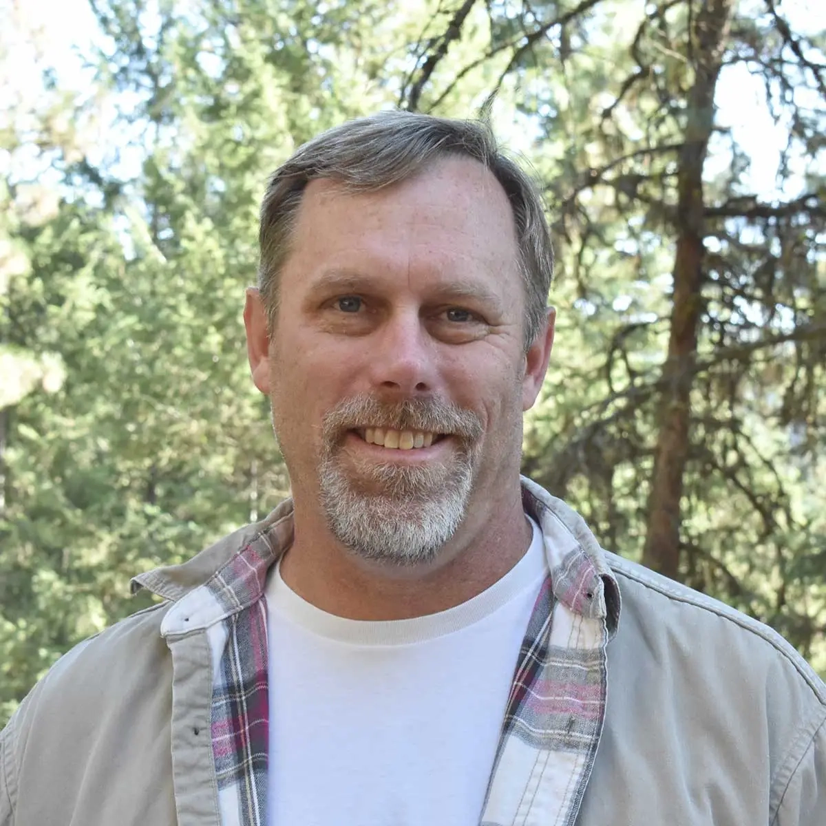 A portrait shot of a man smiling