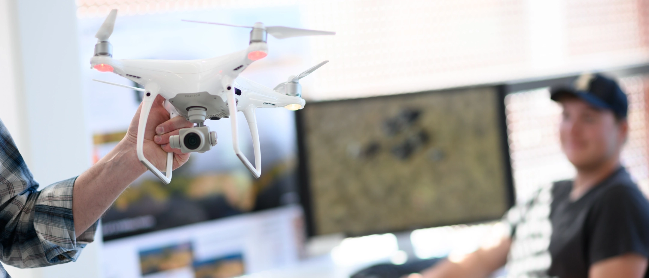 Student Dan Lauritzen working in the drone lab with Jason Karl for the College of Natural Resources