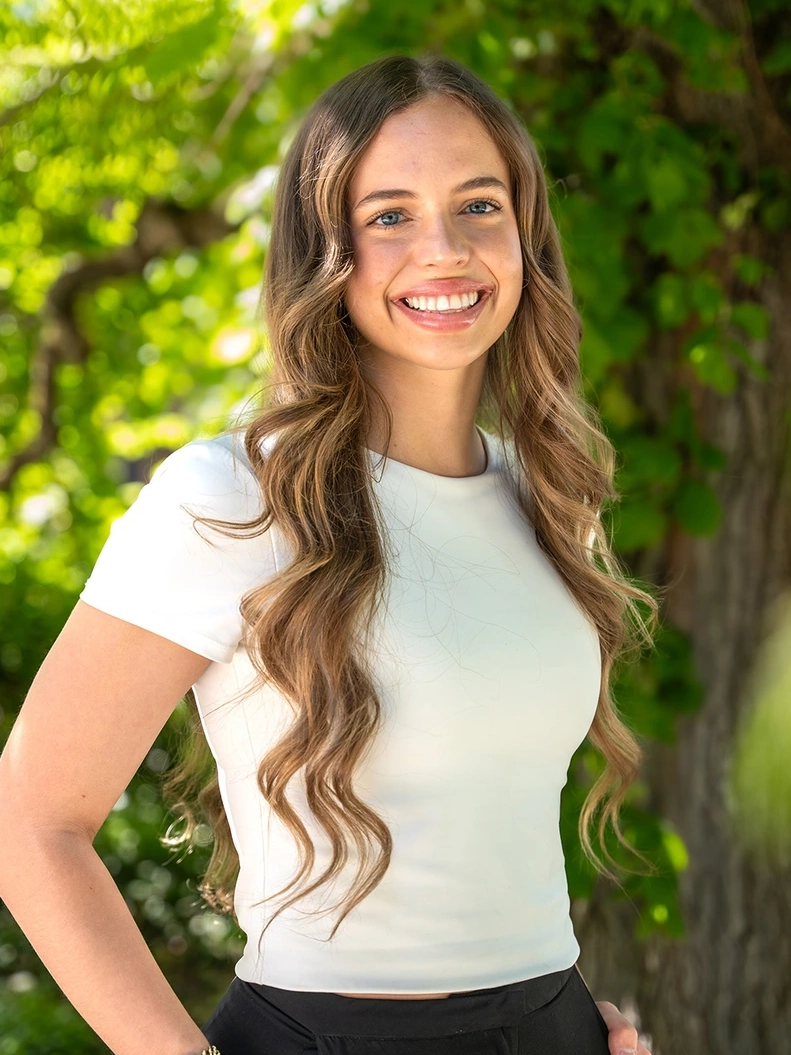 Abby Thomson smiles outdoors