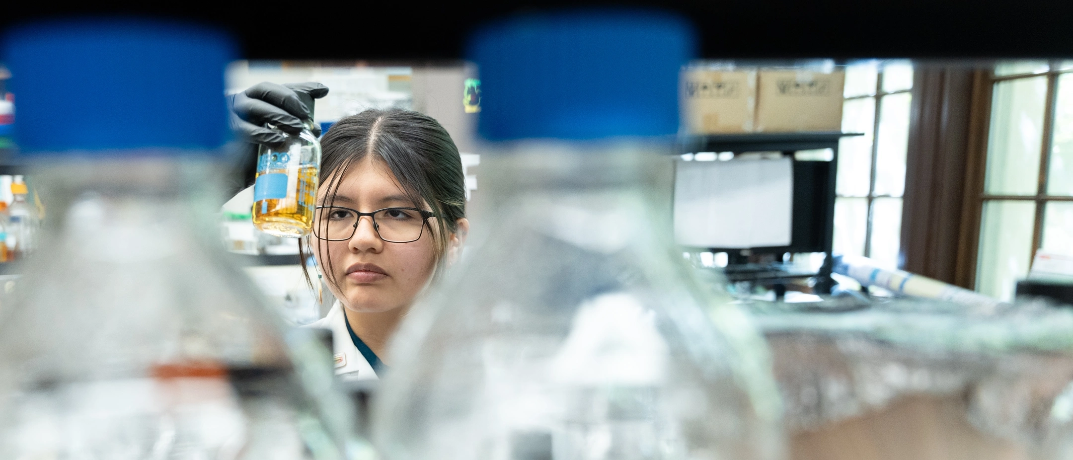 Goldwater scholar Dayna Bruiton from Caldwell, Idaho working in the Paul Rowley lab working with Yeast growth medium.