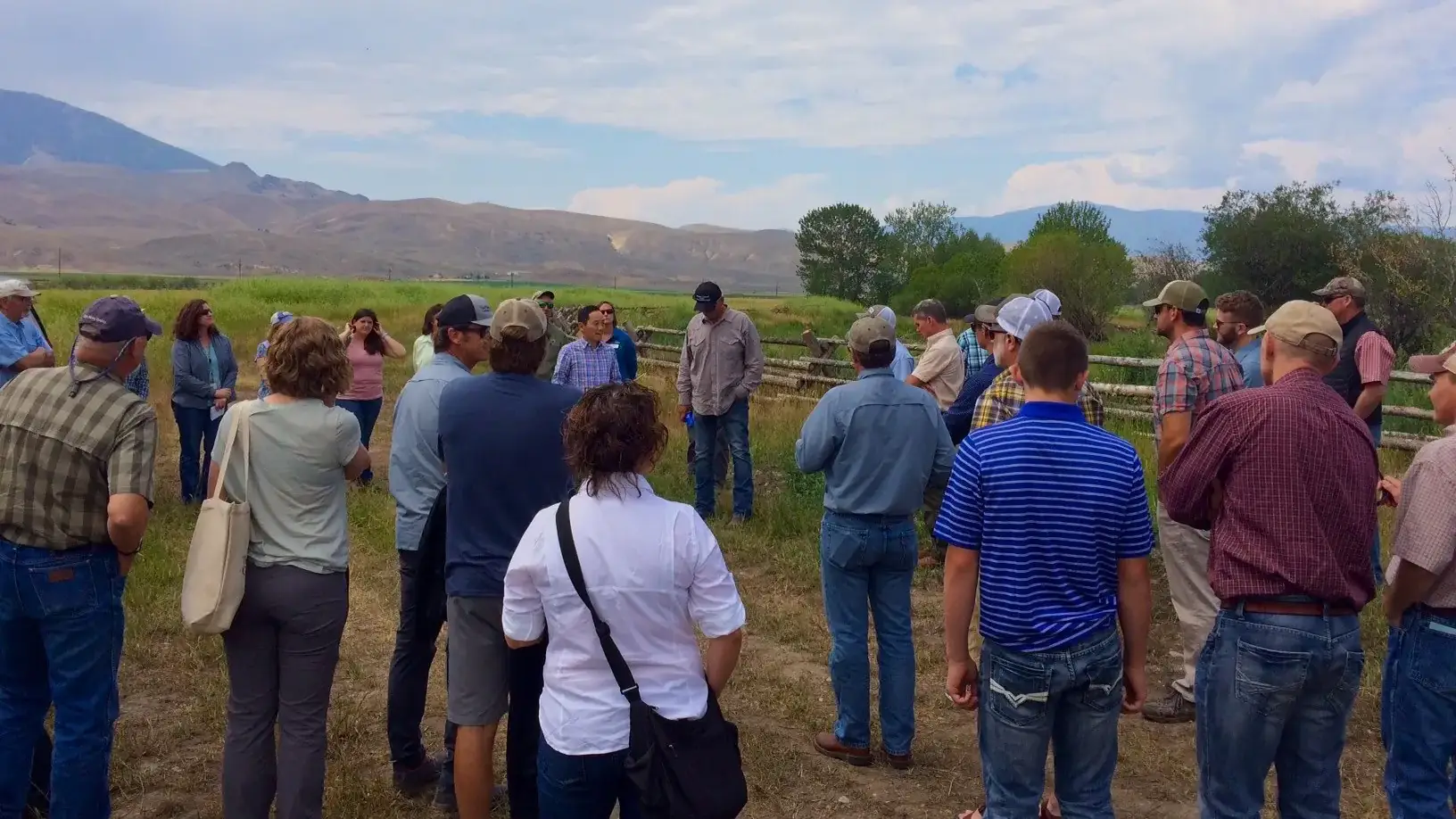 McClure salmon research working group gathered in field near the river.