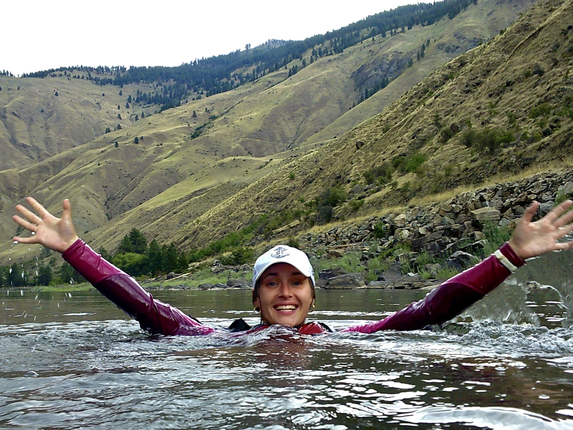 Jo Rodzinka with her arms up in the water