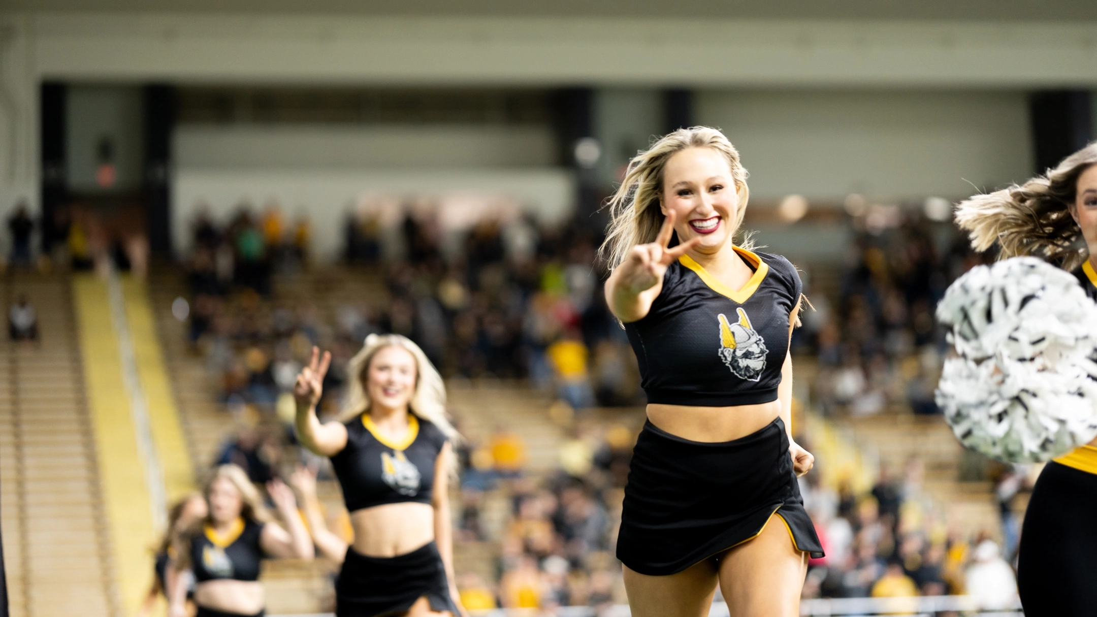 The Vandal Spirit Squad runs onto the football field.