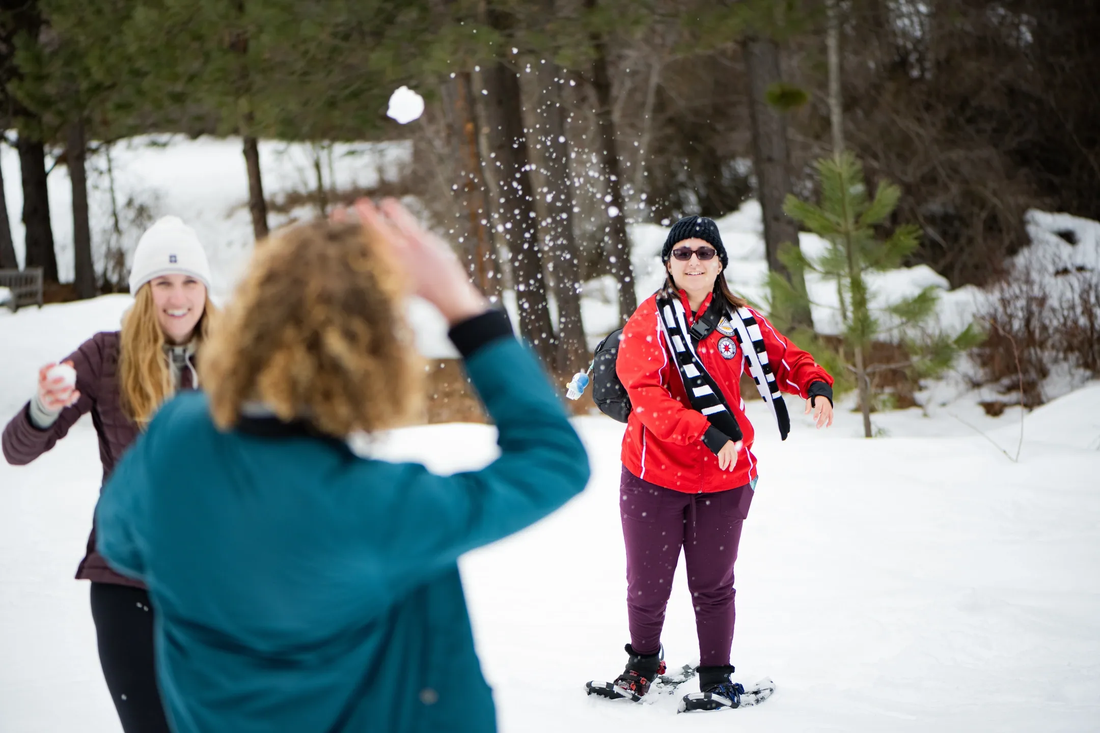 University of Idaho students enjoying the outdoors in the winter while being cozy with one another. Embracing the Norwegian idea of "koselig".