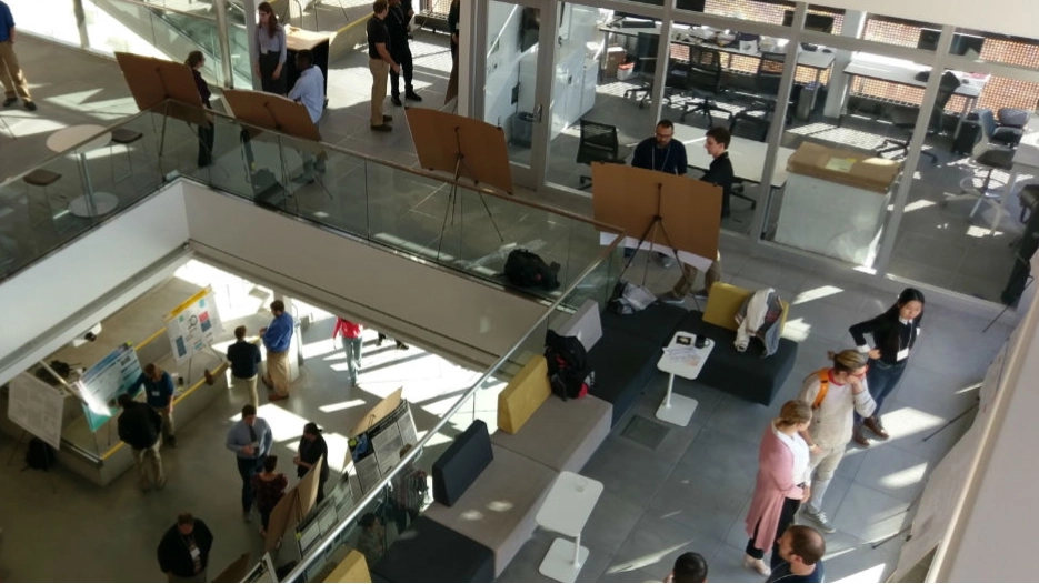 An aerial shot of people walking inside a building