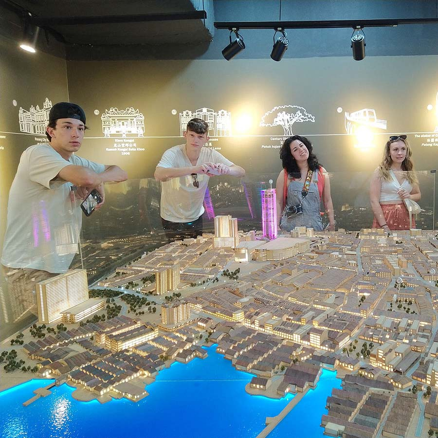 Students observing the planning of Historical George Town at Penang State Gallery