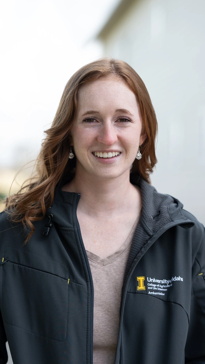 A portrait of a woman wearing a jacket.