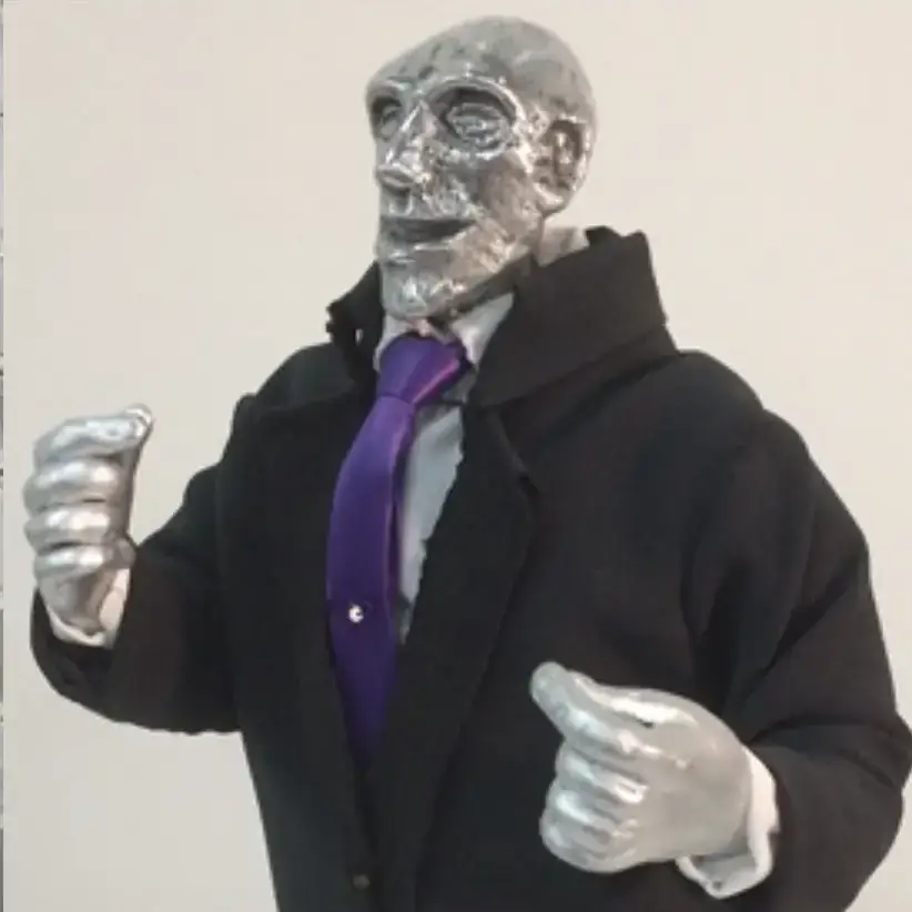 Sculpture of a silver man wearing a suit