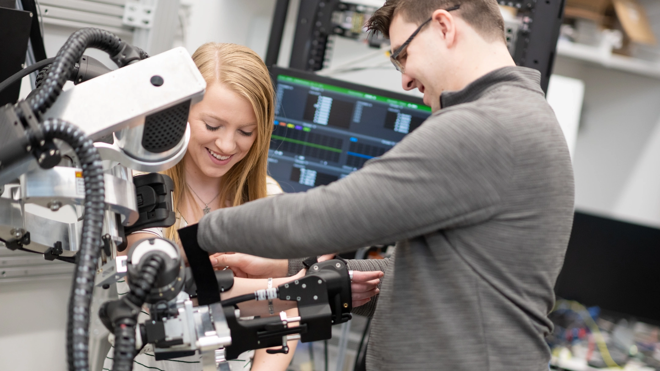 University of Idaho College of Engineering students and faculty working with therapeutic robots made to assist in physical therapy.