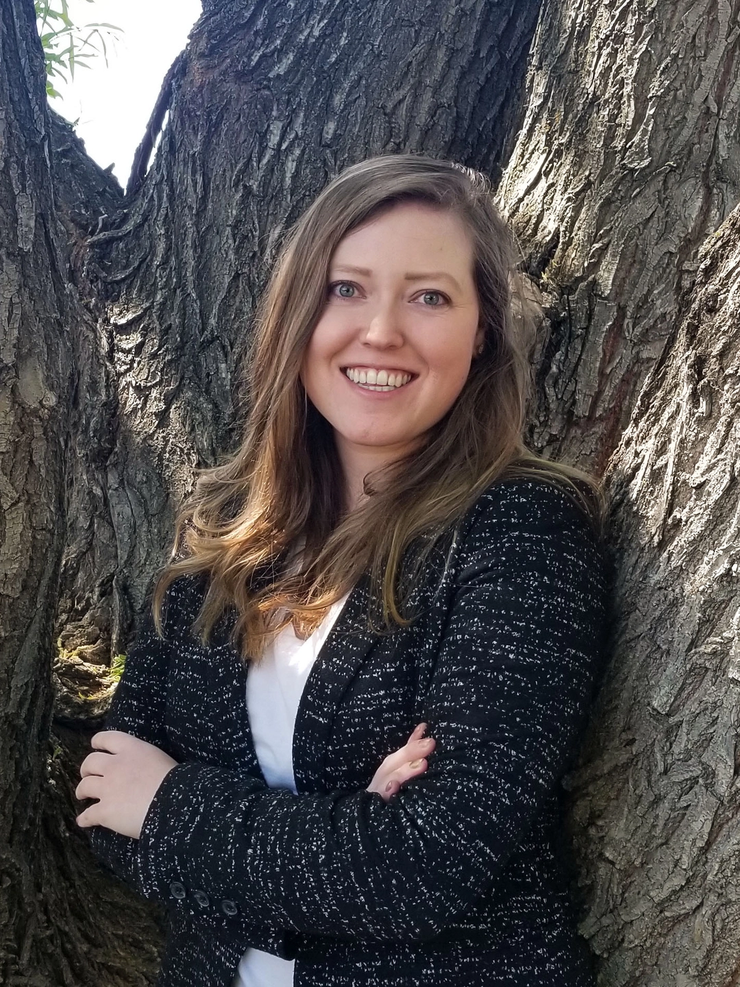 Woman standing in front of a tree
