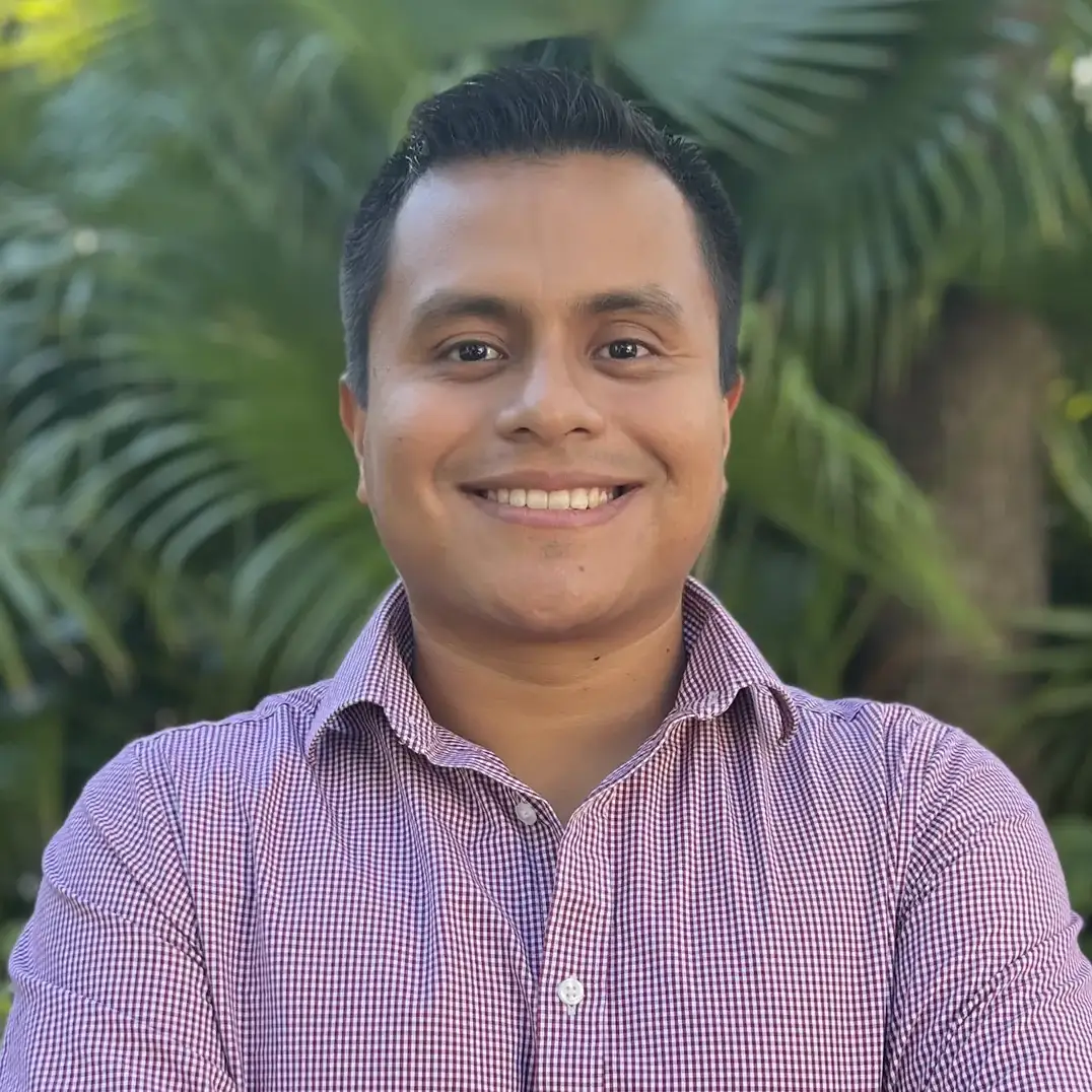 A portrait of a man with his arms crossed