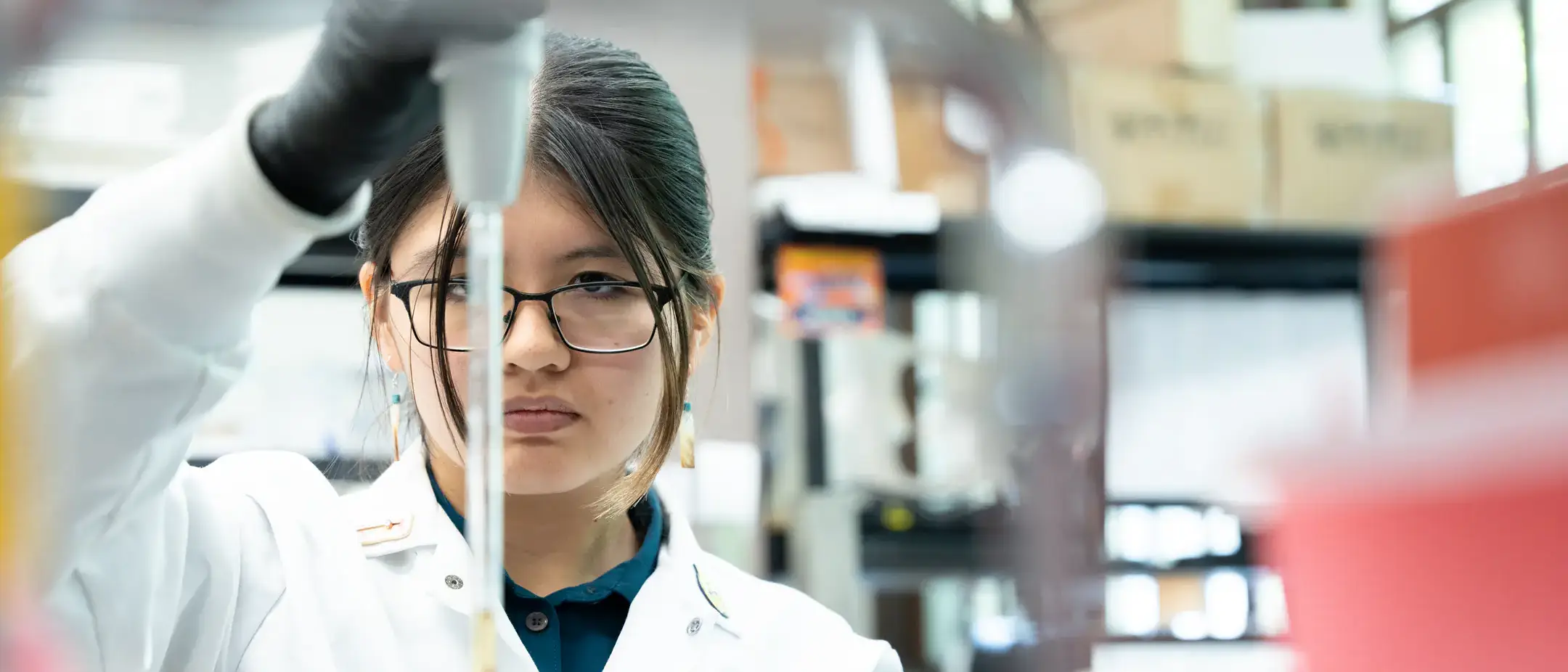 Goldwater scholar Dayna Bruiton from Caldwell, Idaho working in the Paul Rowley lab working with Yeast growth medium.