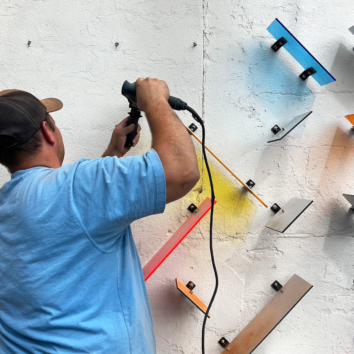 Students installing back paneling for the Moscow Chamber of Commerce.