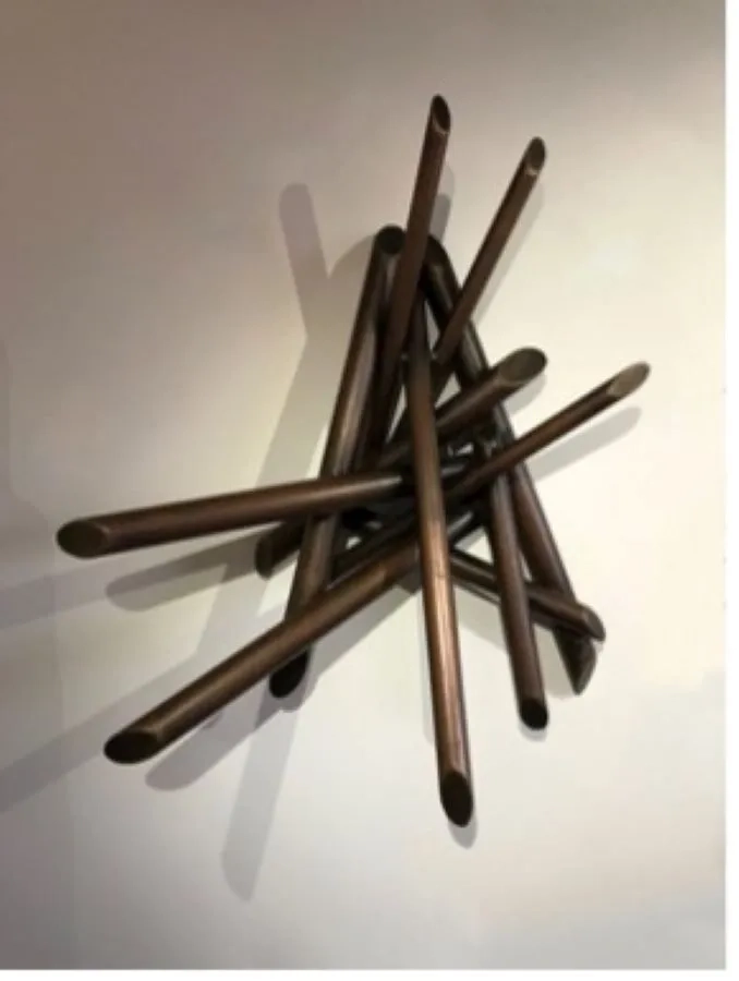 A knot of straight sticks, wedged together at varied angles.